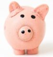 small pink piggy bank with white background